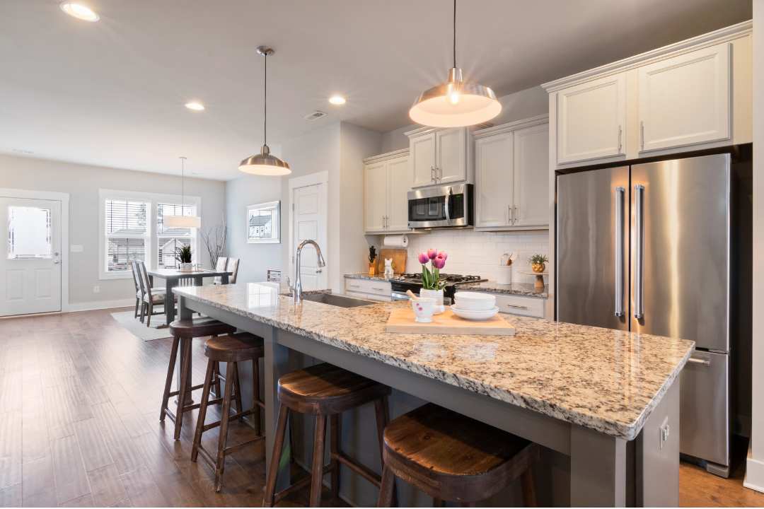 A spotless open-plan kitchen and living area in a Kansas City Metro home